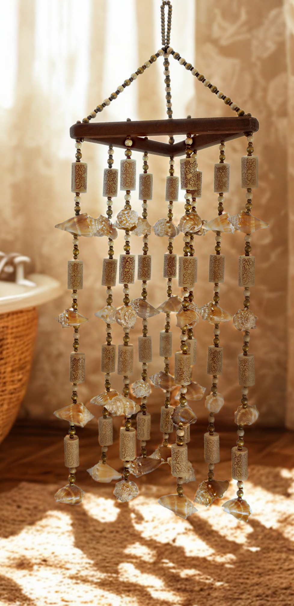 Decorative wind chime with hanging shells and corks in a room with a textured wall.