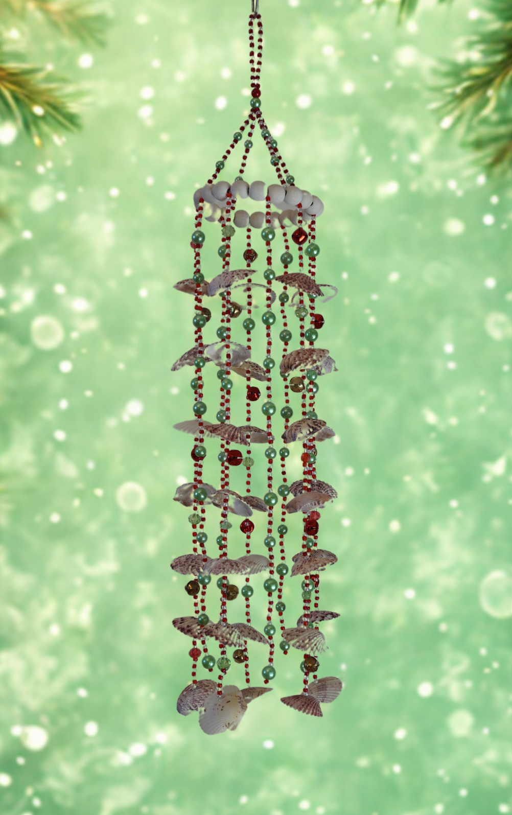 Decorative shell wind chime with on a light green background
